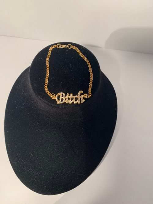Gold Assertive Female Bracelet with Small Gold Chain and Paved Clear Swarovski Stones Spelling “Bitch” in Italics